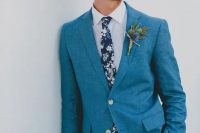 a bright blue suit, a white shirt and a floral tie is a chic and vibrant outfit idea with a touch of edge