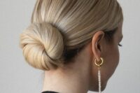 a classic ballerina low bun with a sleek top is a perfect solution that works with most of formal outfits at the wedding