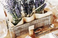 a crate with lavender in jars is a great rustic centerpiece, it’s perfect for summer weddings