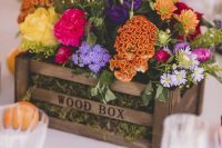 a crate with moss and super bright blooms is a perfect summer wedding centerpiece that you can make in minutes