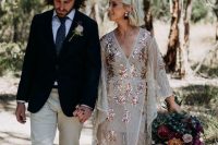 a creative neutral kimono wedding dress with rose gold embellished touches and metallic shoes are wow