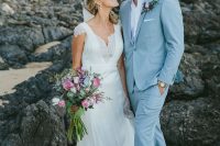 a delicate coastal groom’s look with a light blue suit, a white shirt, brown shoes and a boutonniere is amazing