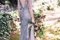 a dusty blue embellished lace applique wedding dress with short sleeves, a V-cut back is a very delicate and lovely idea