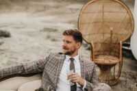 a grey and beige plaid pantsuit, a white shirt, a grey tie are a great combo for a super modern groom’s look with a touch of color