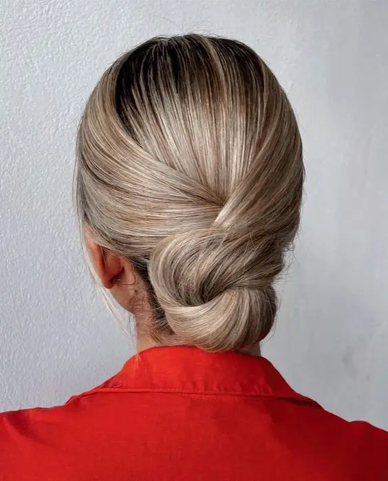 a knotted low bun with a sleek top is a perfect solution for medium and long hair, it looks elegant and chic