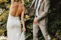 a light grey suit, a white shirt, a green tie and light brown shoes are a lovely groom’s outfit for spring or summer