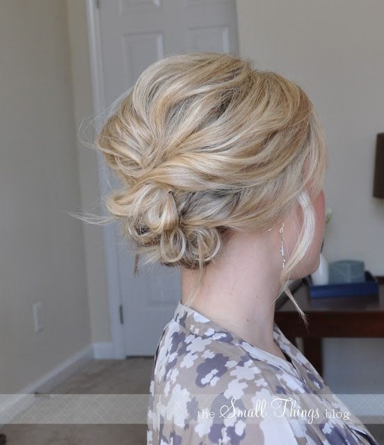 a messy and wavy side updo with a bump on top and face-framing hair is a cool idea for medium hair