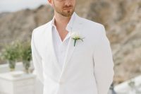 a minimal white groom’s look with a suit and a shirt plus a boutonniere is a lovely idea for a spring or summer wedding