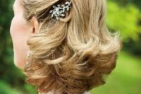 a refined vintage half updo with some vintage-inspired hairpieces and curled ends is a lovely idea to show off thick locks