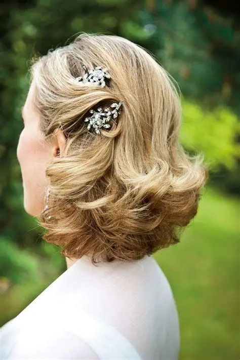 A refined vintage half updo with some vintage inspired hairpieces and curled ends is a lovely idea to show off thick locks