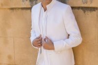 a relaxed groom’ look with a white linen suit and a white striped shirt is a cool idea for a spring or summer wedding