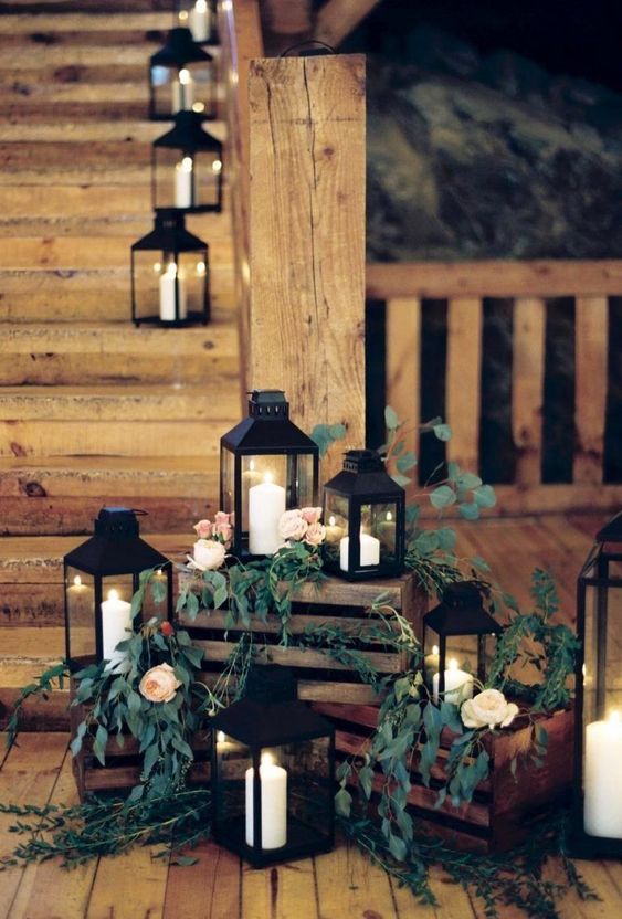 a rustic wedding decoration of crates, greenery, pastel blooms, candle lanterns is amazing for a rustic wedding