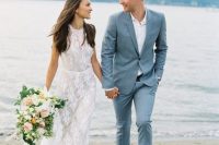 a simple and stylish light blue suit, a white shirt and brown shoes for a chic blue beach wedding