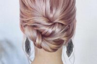 a stylish twisted and woven low updo with a sleek top and some locks down is a great solution for medium and long hair