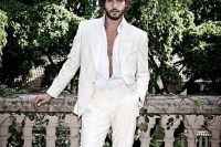 a tropical groom’s look with a white suit, a white shirt and espadrilles is a great solution for a hot weather wedding