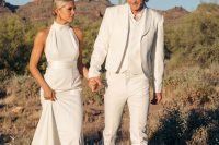 a white groom’s look with a three-piece suit, brown shoes and a hat is a great idea for a boho wedding