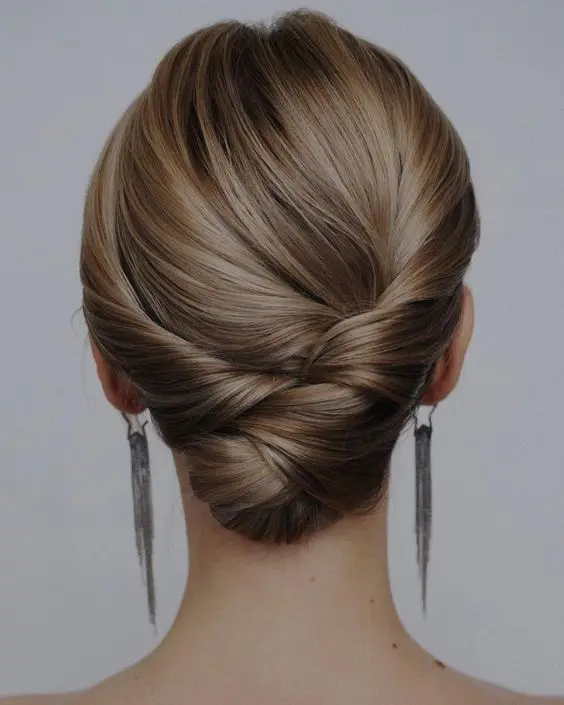 an elegant and chic twisted and braided low updo with a sleek top is always a good idea if your hair is long enough