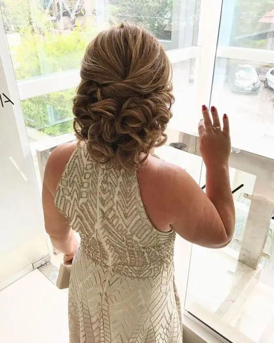 an elegant curled half updo with a dimensional top is always a good idea if you have medium or long hair
