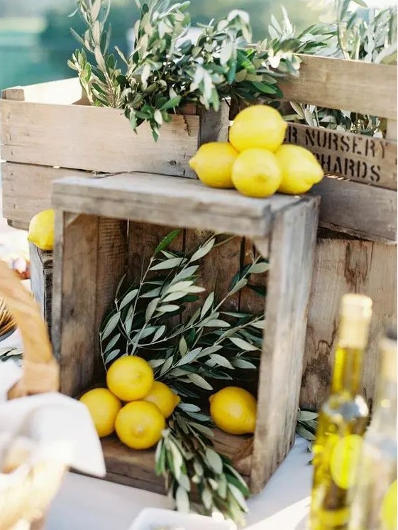 beautiful wedding station decor with crates, olive branches and lemons is a lovely idea for a rustic wedding
