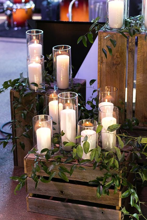 chic and simple wedding decor made of crates, with greenery on top and pillar candles is great for rustic weddings