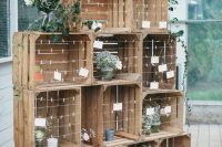 rustic wedding decor made of crates with escrot cards, floral arrangements will be perfect for a rustic wedding