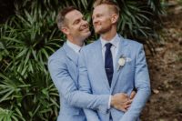 01 These handsome grooms were wearing light blue suits and navy ties for their oceanside garden wedding