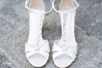 02 The bridal shoes were chic white embellished heels with ankle straps