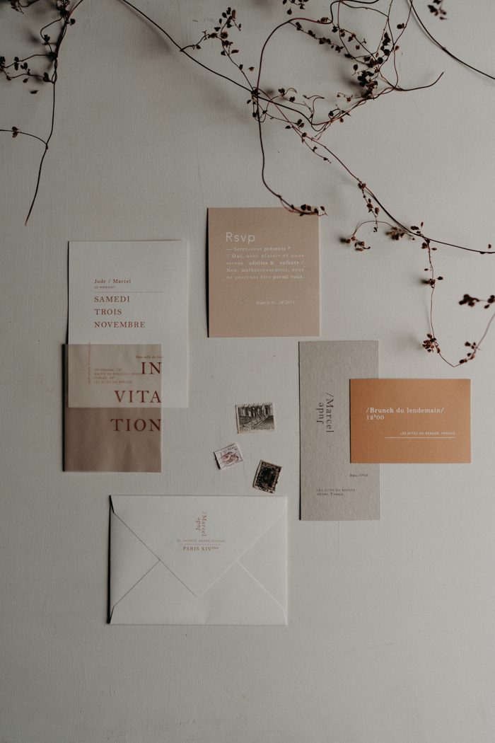 The wedding invitation suite is a modern one, in light fall-inspired shades