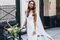 02 a chic minimalist wedding look with a white slip dress and a long veil plus waves down