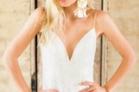 02 a glam and romantic bridal look with a lace sheath dress and oversized tassel earrings