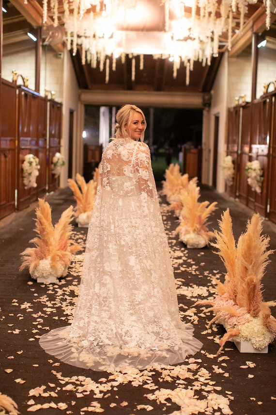 Here the wedding aisle began, it was done with petals, pampas grass and blooms