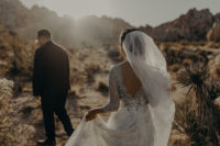 03 The bride was wearing a chic lace embellished dress by Claire Pettibone and a long veil