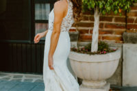03 The bride was wearing a sheath wedding dress with a lace back, a halter neckline and fringe sandals