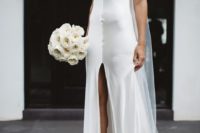 03 a fresh take on a classic slip dress, a white silk slip gown with a deep V-neckline and a front slit