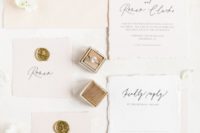 04 The wedding invitation suite was done in blush, with black calligraphy and gold stamps