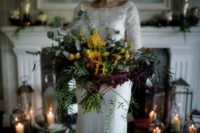 05 The wedding bouquet was done with textural and cascading greenery, burgundy and yellow blooms to embrace the fall