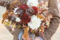 05 a fall-inspired dark wedding bouquet with leaves, herbs and white and burgundy blooms