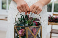 06 The bride was rocking a lantern filled with flowers and greenery instead of a usual bouquet