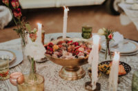 07 The wedding tablescape was done with lace, blooms and candles for an eclectic feel
