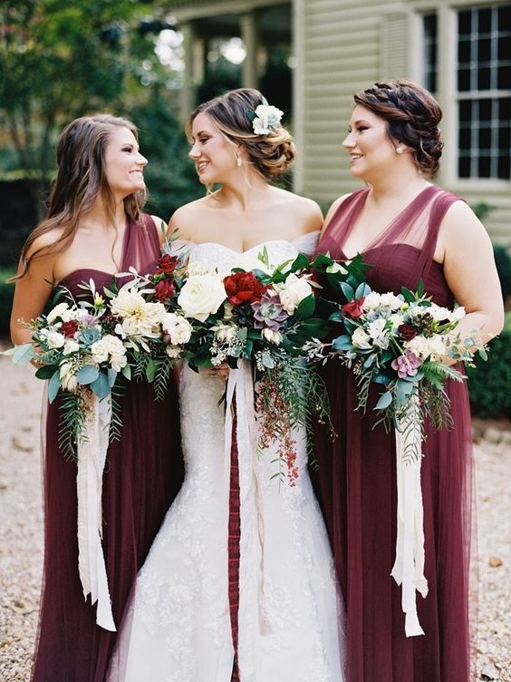 elegant burgundy maxi dresses with a sheer detail on the shoulders and a layered skirt