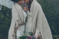 08 a large sheer umbrella for the couple and a common blanket coverup for more romance