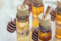 08 honey wedding favors in little jars with corks look very cozy and very fall-like