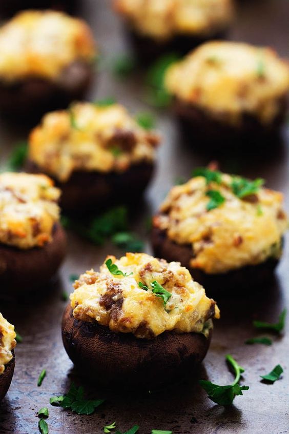 sausage stuffed musrooms with cheese and fresh greenery for a tasty fall appetizer