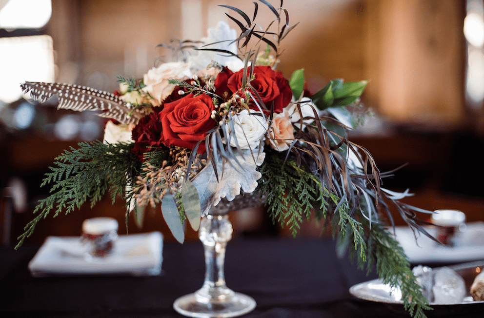The centerpieces were lush ones, with much greenery, feathers and lush blooms