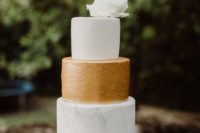 09 The wedding cake was a white, gold and marble one with a large bloom on top
