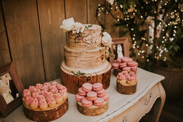 The wedding cake was a birch-inspired one, and pink macarons and cupcakes were also served
