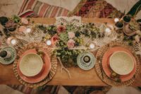 10 The wedding tablescape was done with a macrame table runner, woven chargers, greenery, flowers and succulents plus candles