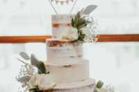 11 The wedding cake was a naked one, topped with fresh blooms and a bunting topper