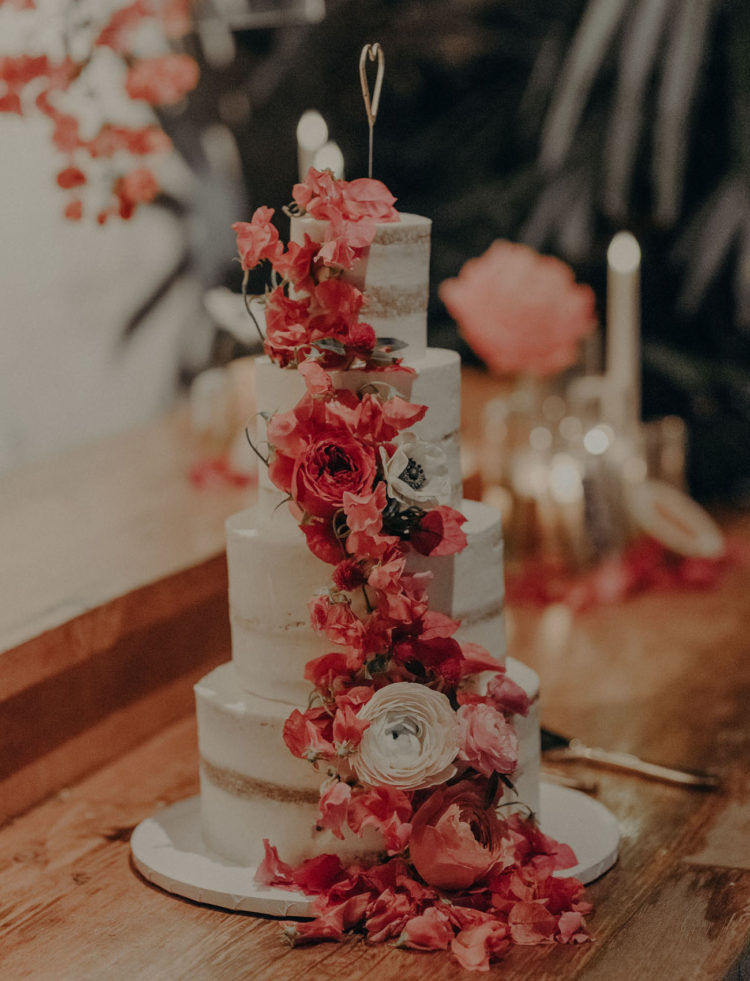 The wedding cake was a naked one, with lush blooms to match
