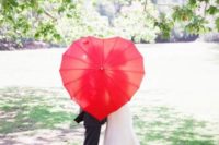 12 a heart-shaped red umbrella can be used for taking eye-catchy pics